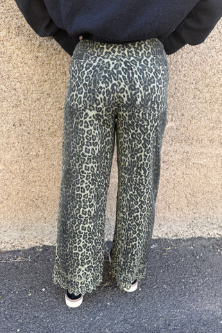 Person wearing patterned leggings on a pavement