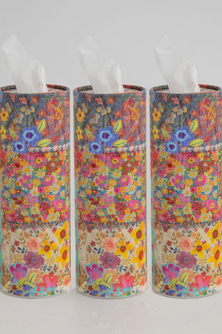 Three floral-patterned tissue paper rolls on a white background